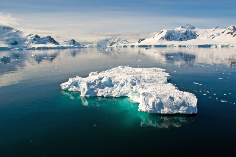 antarctica blue icebergs in tranquil channel sstock