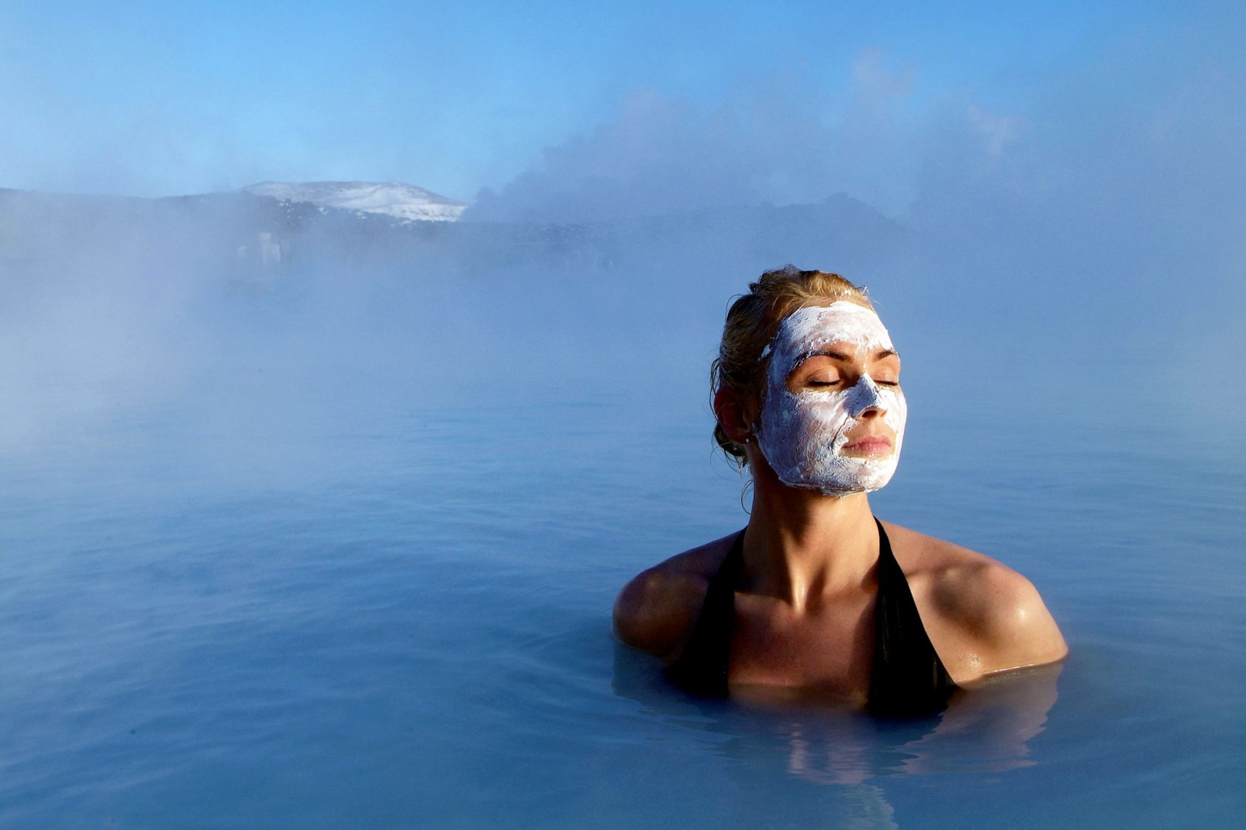 iceland south west blue lagoon woman with silica mud blgn