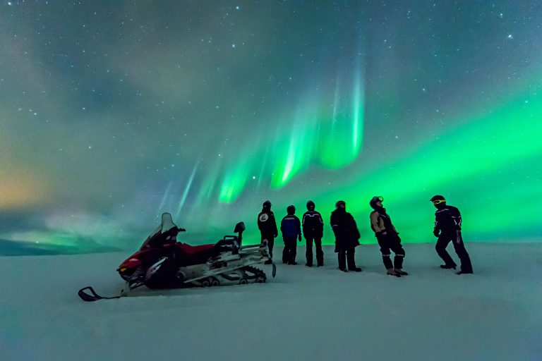 norway snowmobiles and aurora arctic coast htgrtn