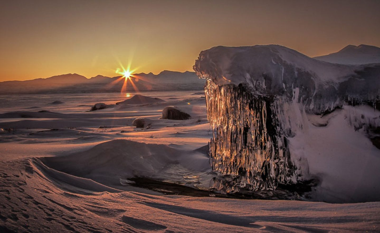 swedish lapland stora sjofallet winter sun over frozen landscape ss