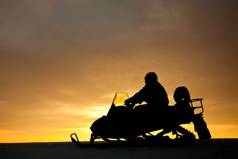 norway sunset snowmobiling istk