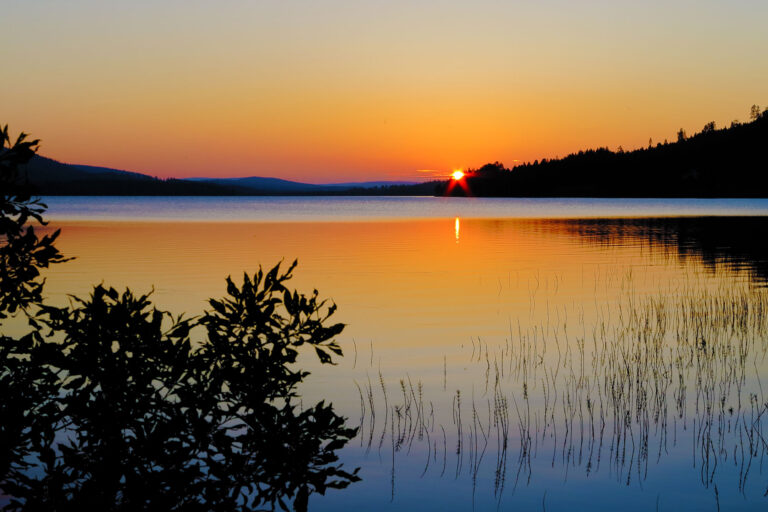 Midnight sun over lake in Sweden