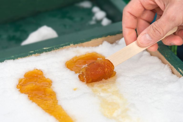 canada hot maple taffy syrup on snow istk