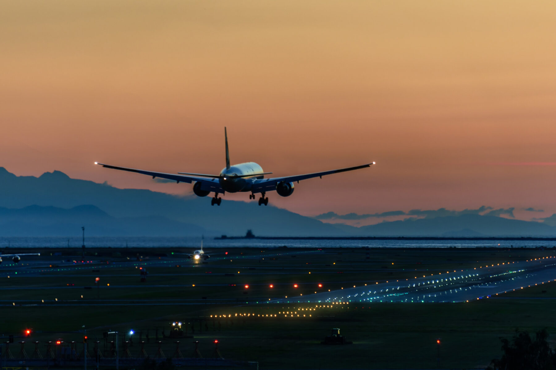 canada plane landing at sunset istk