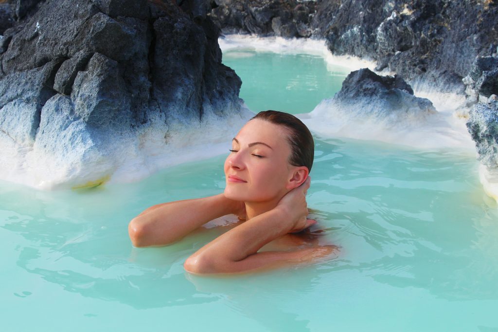iceland south west blue lagoon woman relaxing istk