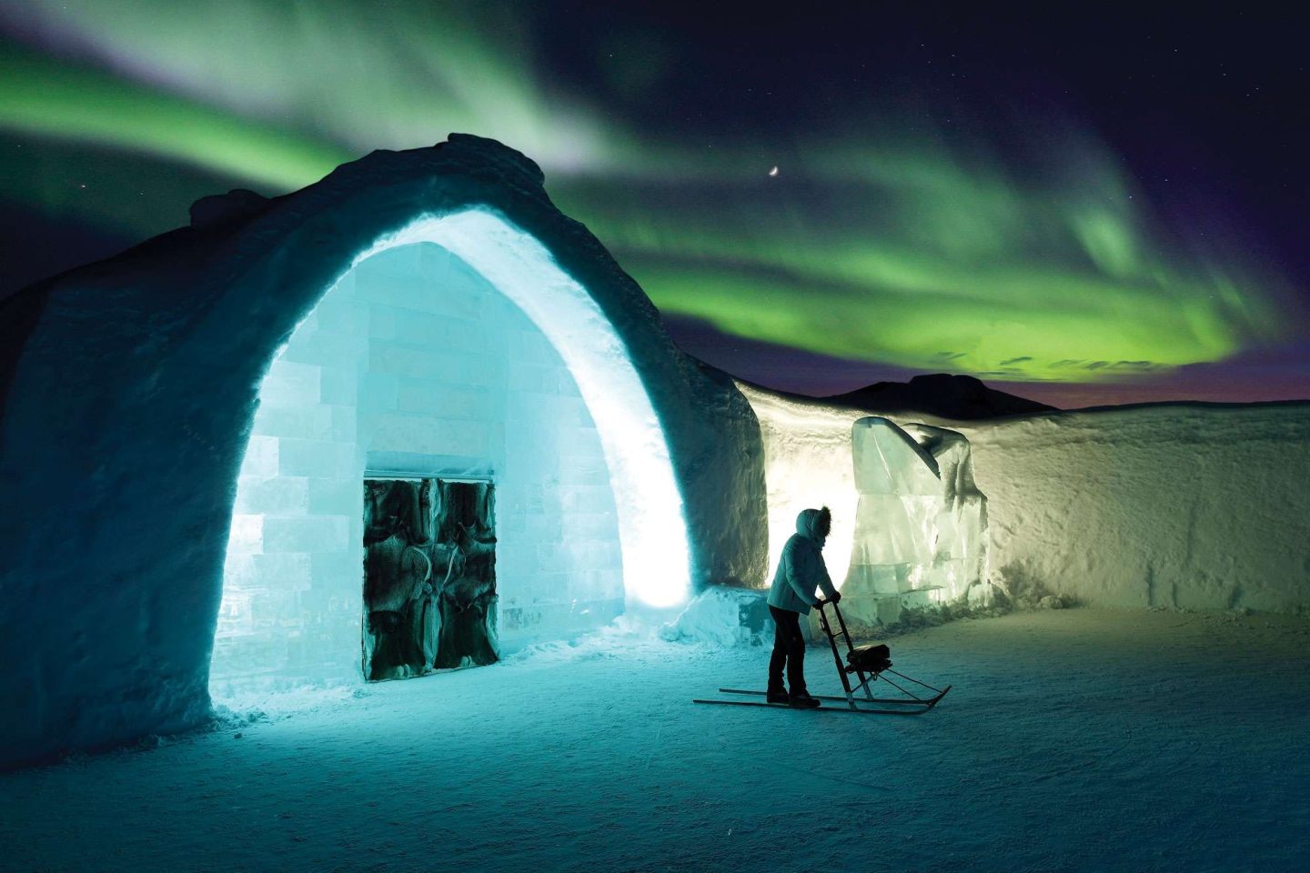 northern lights over the icehotel in Swedish Lapland