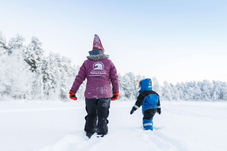 finnish lapland nellim adult child in snow