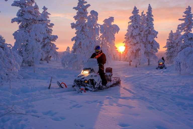finnish lapland star arctic hotel snowmobile sunset