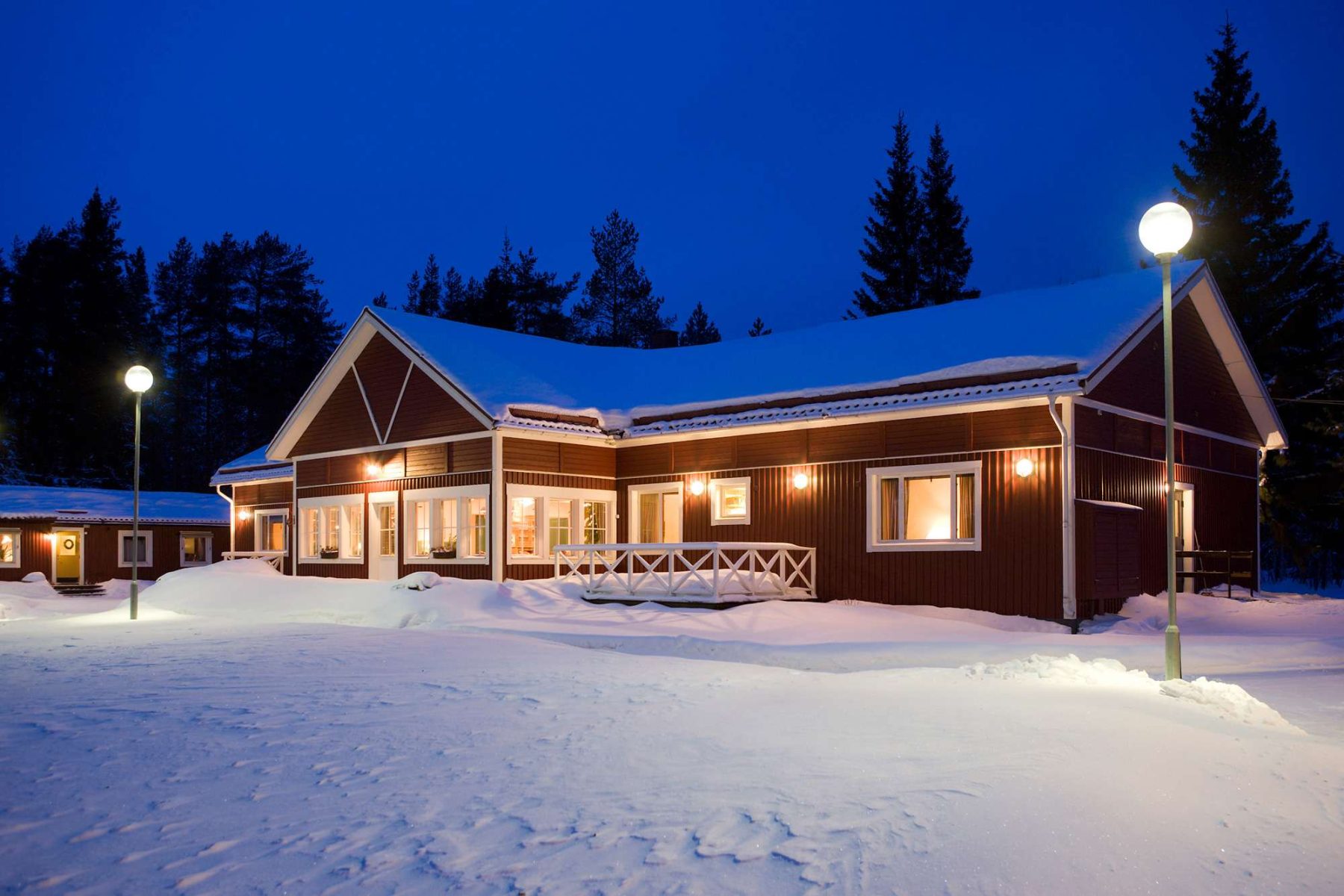 swedish lapland pine bay lodge exterior snow view pp
