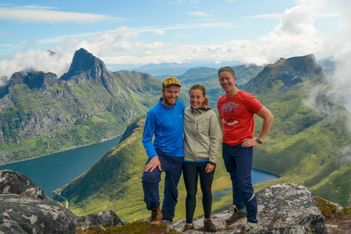 northern senja hikers at top of segla mountain mefjord brygge