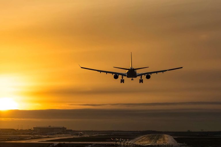 aircraft landing at sunset helsinki istk