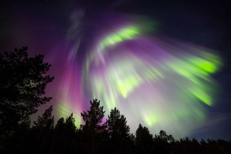 finnish lapland red and green northern lights nellim
