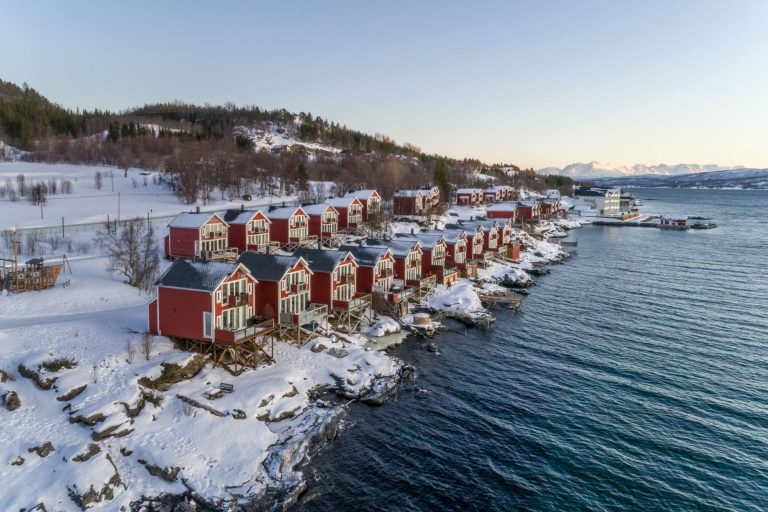 malangen resort cabins along fjord winter