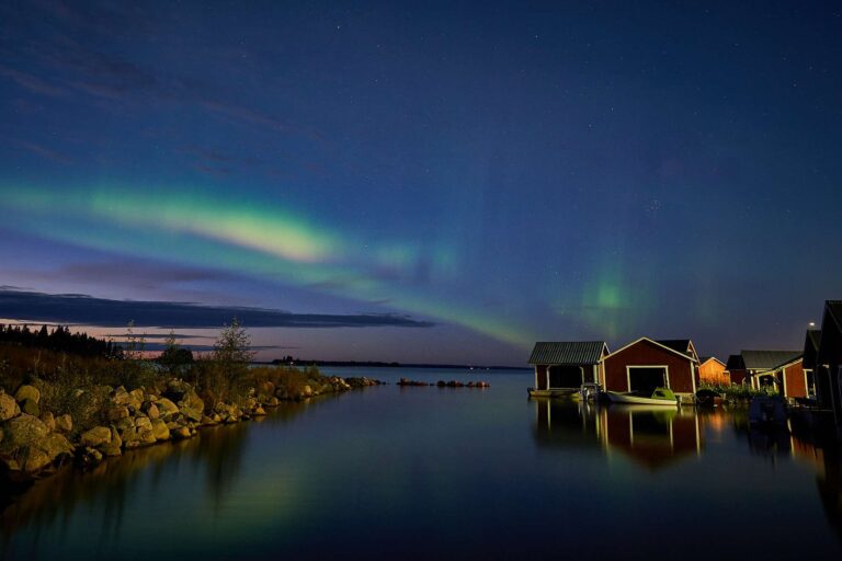 swedish lapland northern lights over water brandon lodge gr