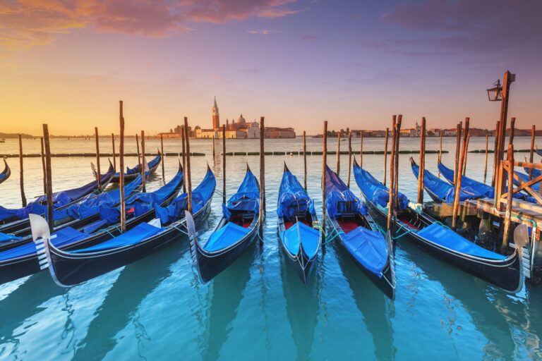 italy venetian lagoon with docked gondolas istk