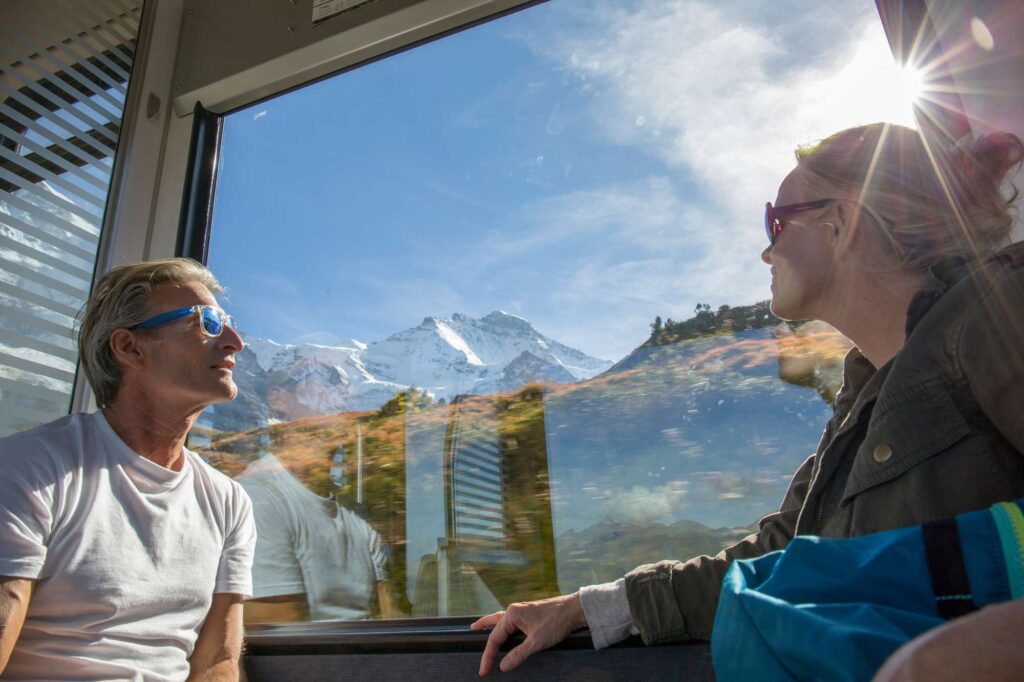 couple enjoying alpine views from train istk