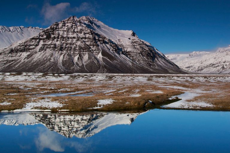 north iceland siglufjordur snow topped mountain reflection istk 1