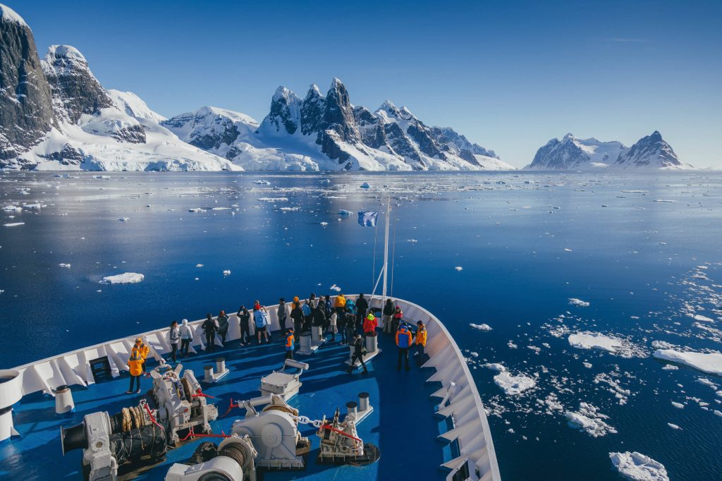 antarctic peninsula bow of ship cruising through tranquil channels qe