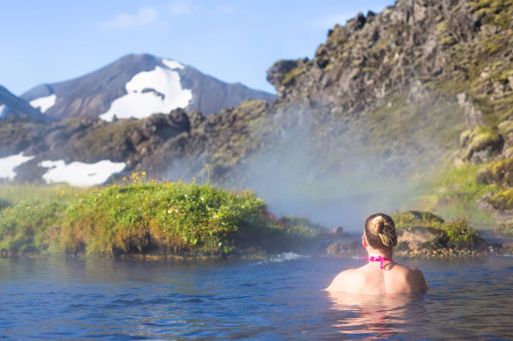 iceland woman relaxing in hot springs landmannalaugar astk
