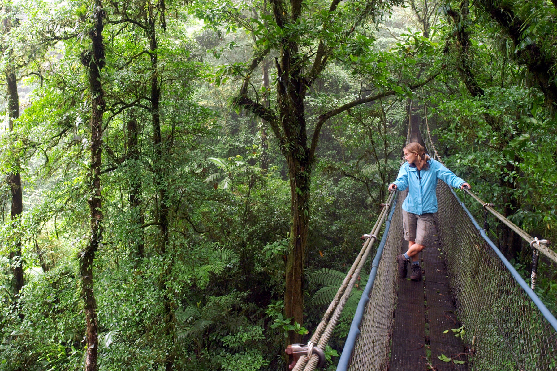 costa rica female on hanging bridge arenal national park istk
