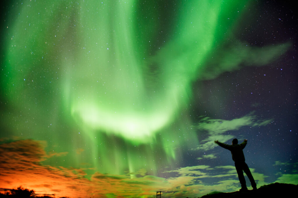 iceland aurora display with male istk