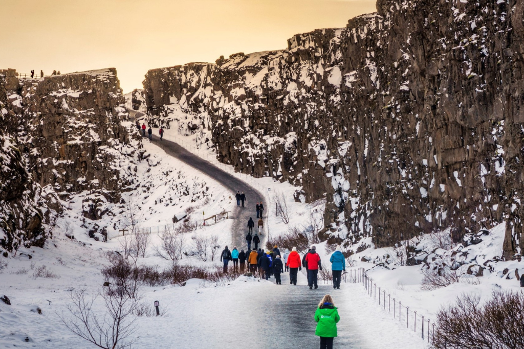 Picture of people hiking up a snowy hill in Iceland