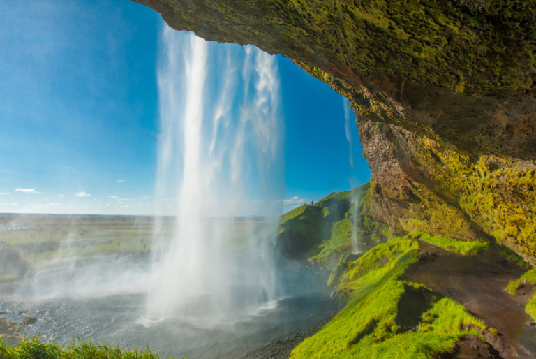 Picture of Seljalandsfoss waterfall in Iceland over a cliff with green moss